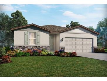 Charming single-story home featuring stone accents, a two-car garage, and lush landscaping at 7736 Gilchrist Springs Dr, Parrish, FL 34219