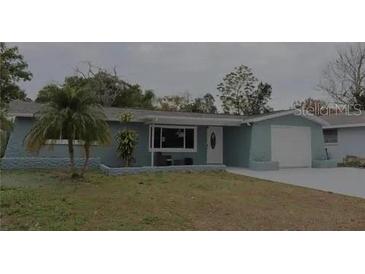 Charming single-story home with a well-maintained lawn and a cozy front porch at 3841 Chaffey Dr, New Port Richey, FL 34652