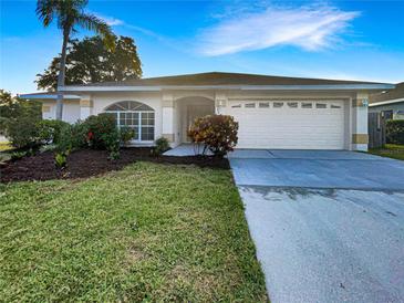 Charming single-story home with a well-manicured lawn, two-car garage and beautiful landscaping at 3403 30Th E Ln, Bradenton, FL 34208