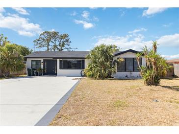 Charming single-story home featuring a well-maintained lawn and a freshly painted exterior at 75 Virginia Ct, Englewood, FL 34223