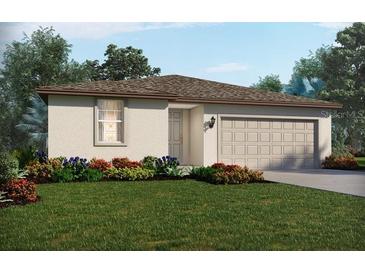 Charming single-story home with a well-manicured lawn and a two-car garage at 7740 Gilchrist Springs Dr, Parrish, FL 34219