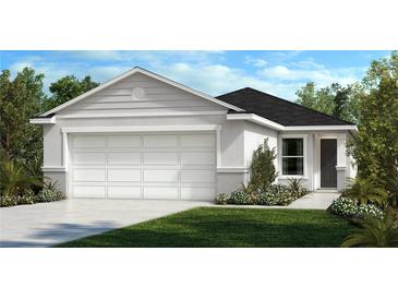 Charming single-story home with a two-car garage, landscaped front yard, and neutral gray exterior at 11621 Firespike St, Riverview, FL 33578