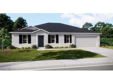 Traditional home featuring professional landscaping, a two-car garage, and neutral colors at 25416 Jubal St, Punta Gorda, FL 33955