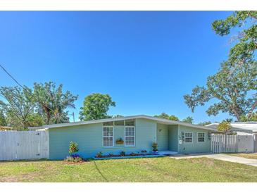 Charming single-story home with well-maintained lawn and landscaping at 505 Hedge Row Rd, Brandon, FL 33510