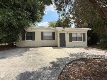 Charming home with a large driveway and curb appeal at 4617 John Bell Jr Dr, Tampa, FL 33610