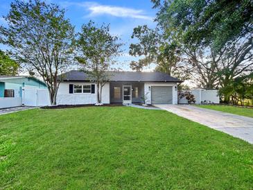 Charming single-story home features a well-manicured lawn and inviting curb appeal at 7490 Locust Ne St, St Petersburg, FL 33702