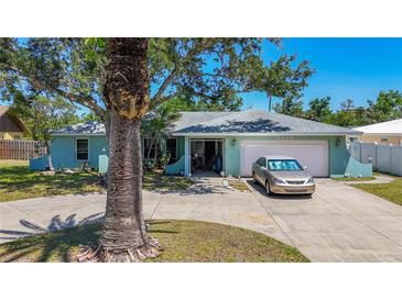 Charming single-story home with a well-maintained yard, mature tree, and a private driveway at 1369 Brookside Dr, Venice, FL 34285