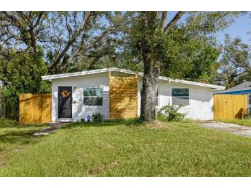 Charming single-story home with a well-maintained lawn and inviting front entrance at 2356 Kingston S St, St Petersburg, FL 33711