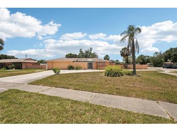 Lovely single-story home with a well-maintained front yard and a long driveway at 1301 Lucaya Ave, Venice, FL 34285