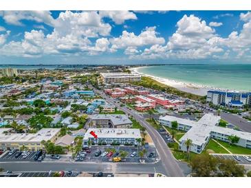 Breathtaking aerial view of a beachfront apartment complex with stunning ocean views and cityscapes at 680 71St Ave # 9, St Pete Beach, FL 33706