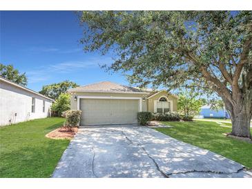 Charming single Gathering home with a well maintained lawn and mature landscaping in a suburban neighborhood at 806 Rocky Mountain Ct, Valrico, FL 33594