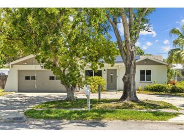 Charming single-story home with an attached garage and beautiful mature trees in a desirable neighborhood at 2302 16 W St, Palmetto, FL 34221