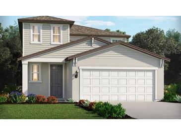 Charming two-story home featuring an attached two-car garage and well-manicured landscaping at 14076 Crutchfield Ct, Parrish, FL 34219