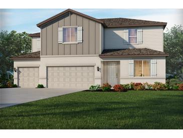 Charming two-story home featuring a two-car garage and beautifully landscaped front yard at 13827 Richland Gulf Cir, Parrish, FL 34219