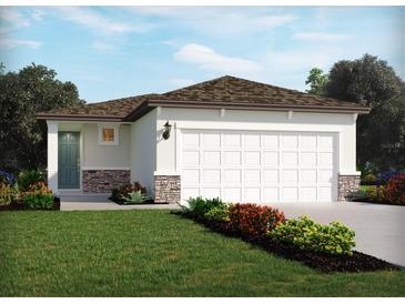 Charming single story home featuring a two car garage, stone veneer accents, and well manicured lawn at 1828 Brekey Way, Zephyrhills, FL 33541
