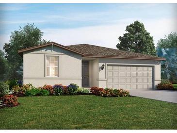 Charming single-story home featuring a two-car garage, neutral color palette, and a well-manicured lawn with colorful landscaping at 7728 Gilchrist Springs Dr, Parrish, FL 34219