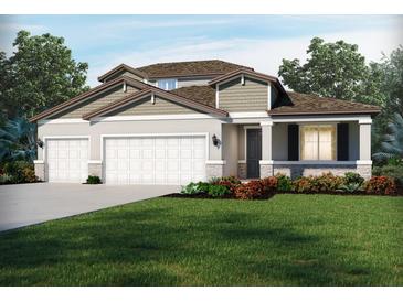 Charming single-Gathering home with a manicured lawn, a two car garage and inviting covered entryway at 1763 Draughton Dr, Zephyrhills, FL 33541
