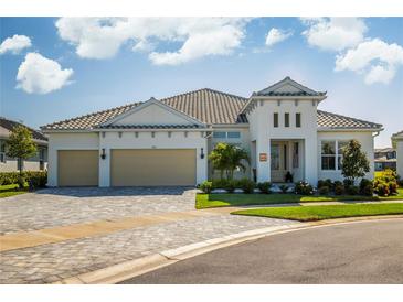 Beautiful single-story home with a two-car garage, neutral color scheme, and manicured landscaping at 4754 Manning Ct, Sarasota, FL 34240