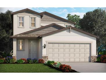Charming two-story home with attached two-car garage and inviting, well-manicured landscaping at 3550 Moscato Dr, Brooksville, FL 34602
