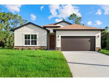 Charming single-Gathering home boasting well-manicured lawn and inviting curb appeal at 1240 Baywood Dr, North Port, FL 34288