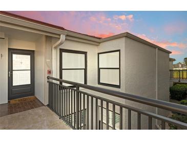 Charming condo exterior with a welcoming entrance door and bronze window frames at 6210 Sun Blvd # 206, St Petersburg, FL 33715