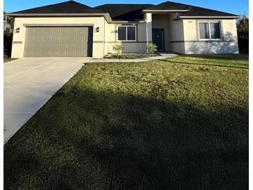 Inviting single-Gathering home with well-manicured lawn and a two-car garage at 10153 Wildcat St, Port Charlotte, FL 33981