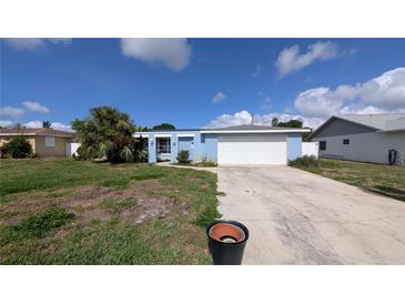 Charming single-story home with a front lawn and attached garage at 249 Malvern Dr, Venice, FL 34293