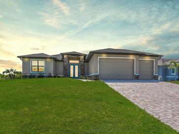 Charming single-story home with a lush green lawn and a welcoming front entrance at 9573 Migue Cir, Port Charlotte, FL 33981