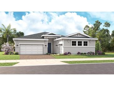 Charming single-story home with a two-car garage, tidy landscaping, and welcoming front entrance at 14448 Woodland Preserve Trl, Parrish, FL 34219