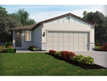 Charming single-story home with a well-manicured lawn and a neutral color scheme at 3674 Moscato Dr, Brooksville, FL 34602