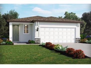 Charming single-story home featuring a two-car garage, neutral paint scheme, and well-manicured landscaping at 571 Sun Chaser Dr, Nokomis, FL 34275