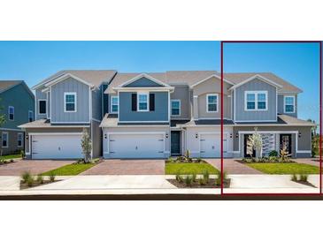 Charming townhomes featuring varied exterior colors, attached garages, and well manicured landscaping at 42862 Park View Dr, Punta Gorda, FL 33982