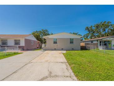 Charming single-story home with a well-manicured lawn and a spacious driveway at 3850 11Th S Ave, St Petersburg, FL 33711