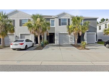 Charming townhome featuring well-maintained landscaping and a private garage at 819 Lucent Sands Ct, Brandon, FL 33511