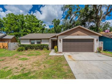 Charming single-story home featuring a two-car garage, landscaped yard, and inviting entrance at 7814 34Th E Ct, Sarasota, FL 34243