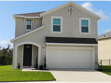 Charming two-story home with a well-manicured lawn, and a two car garage at 5150 San Palermo Dr, Bradenton, FL 34208
