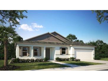 Charming single-story home with well-manicured lawn and attached two car garage at 11456 Libby Rd, Spring Hill, FL 34609