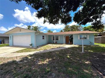 Charming single-story home with an attached garage and well-maintained front yard at 2813 21St W Ave, Bradenton, FL 34205