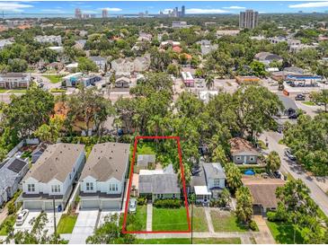 Aerial view of a single Gathering residence with mature trees near downtown, with an outlined property boundary at 2710 W North A St, Tampa, FL 33609