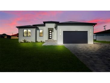 Beautiful single-Gathering home with manicured lawn and modern design elements in a serene setting at 3323 Elkcam Blvd, Port Charlotte, FL 33952