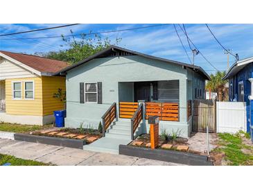 Charming home featuring a gray exterior, newly renovated front porch and welcoming curb appeal at 2904 Sanchez St, Tampa, FL 33605