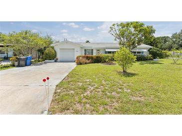 Charming single story home with well-maintained lawn and mature landscaping at 8490 7Th Ln N,, St Petersburg, FL 33702