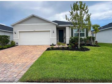 Charming single-story home with well-maintained landscaping and a brick driveway at 3567 74Th Avenue E Cir, Sarasota, FL 34243