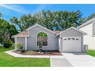 Charming single-story home features a manicured lawn and attached one-car garage at 3703 43Rd W Ave, Bradenton, FL 34205