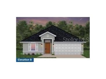 Charming single-story home with a gray exterior, a dark roof, and an attached two-car garage at 4537 Sutherland St # Lot 3, Spring Hill, FL 34609