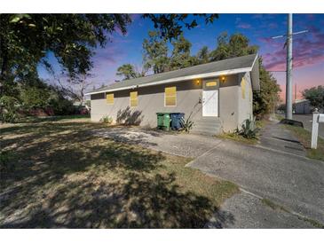 Charming single-story home featuring a well-maintained lawn and a driveway at 3414 E 21St Ave, Tampa, FL 33605