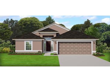 Charming single-story home featuring a neutral color scheme, a two-car garage, and manicured lawn at 4853 Sutherland St # Lot 57, Spring Hill, FL 34609