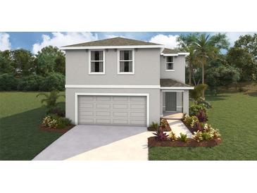 Charming two-story home featuring a two-car garage and well-manicured landscaping at 30863 Wild Juniper Ct, Brooksville, FL 34602