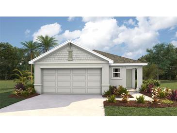 Charming one-story home featuring a covered entrance, two-car garage and complemented by lush landscaping at 30852 Wild Juniper Ct, Brooksville, FL 34602