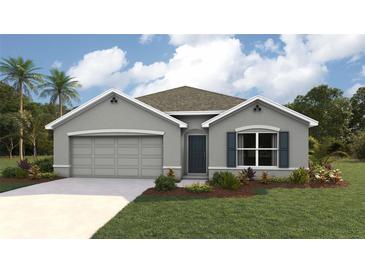 Charming one-story home with a two-car garage, gray exterior, and well-manicured lawn and mature landscaping at 11766 Memorial Dr, Brooksville, FL 34613